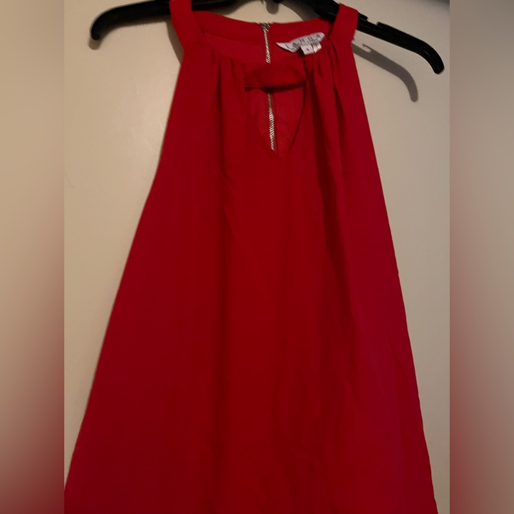 Worn once lined red top with cutout shoulders size S
